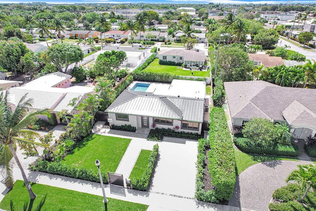 birds eye view of property with a residential view