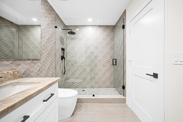 bathroom featuring recessed lighting, a shower stall, vanity, and toilet