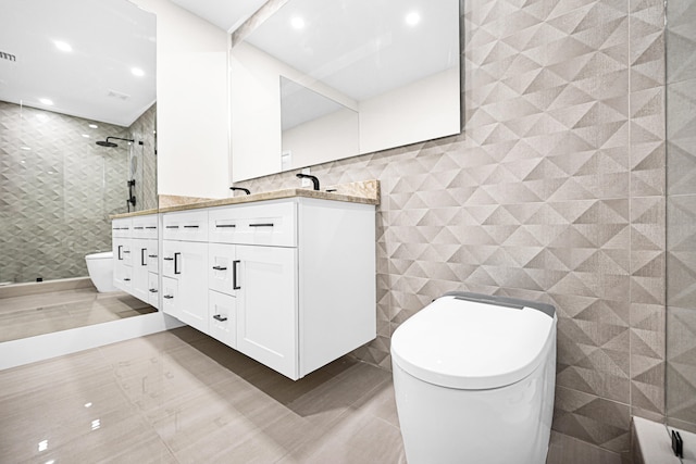 bathroom with tile patterned floors, toilet, tile walls, a shower stall, and double vanity