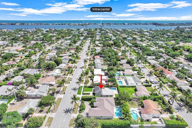 birds eye view of property with a residential view and a water view