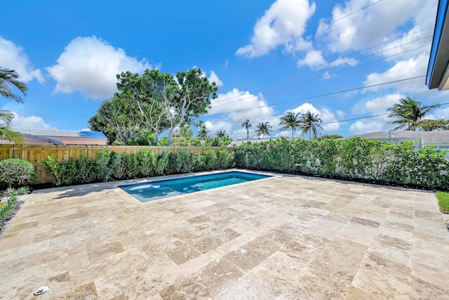 view of pool with a patio area, a fenced in pool, and a fenced backyard