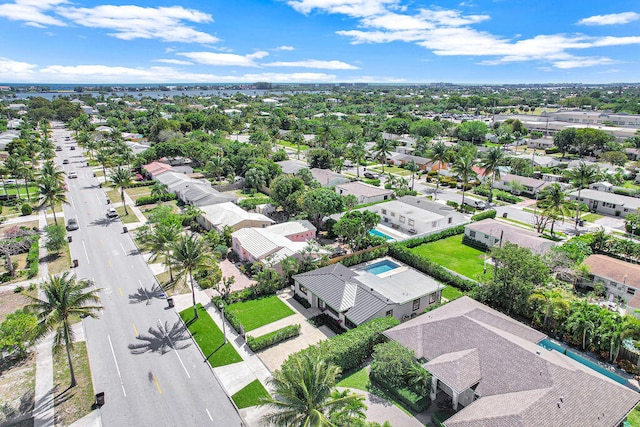 birds eye view of property with a residential view