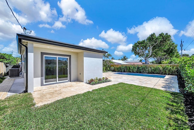 view of yard featuring a patio area, fence, and a fenced in pool