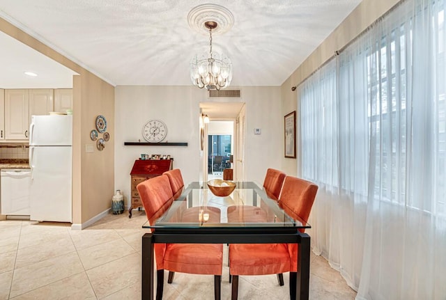 dining room featuring light tile patterned floors, baseboards, visible vents, and a notable chandelier