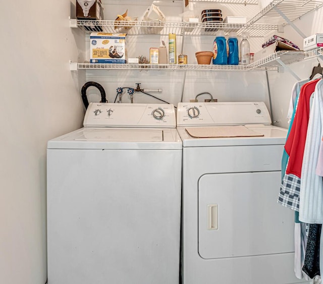 laundry room featuring laundry area and separate washer and dryer