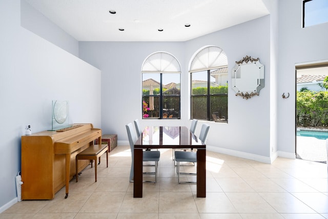 dining area with light tile patterned floors and baseboards