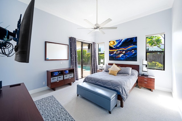 carpeted bedroom featuring access to exterior, a ceiling fan, baseboards, and crown molding