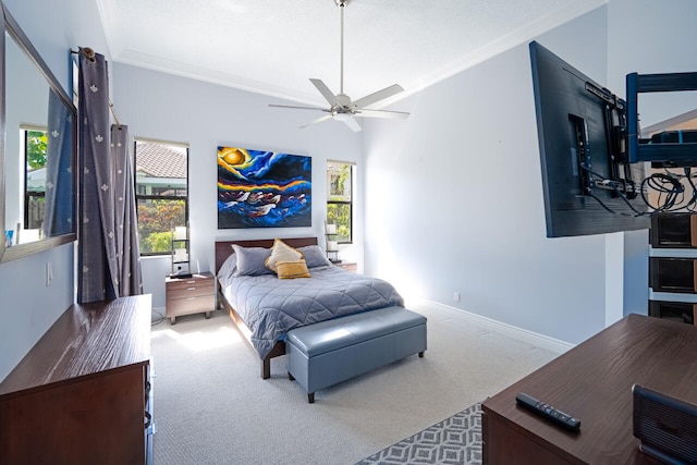 carpeted bedroom with baseboards and crown molding