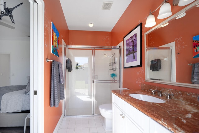 full bath with ensuite bathroom, a stall shower, vanity, and visible vents