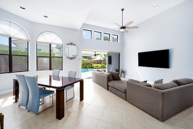 living area with a ceiling fan, recessed lighting, baseboards, and light tile patterned floors