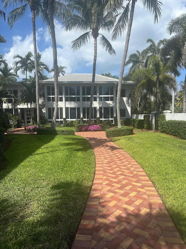 view of community featuring a yard