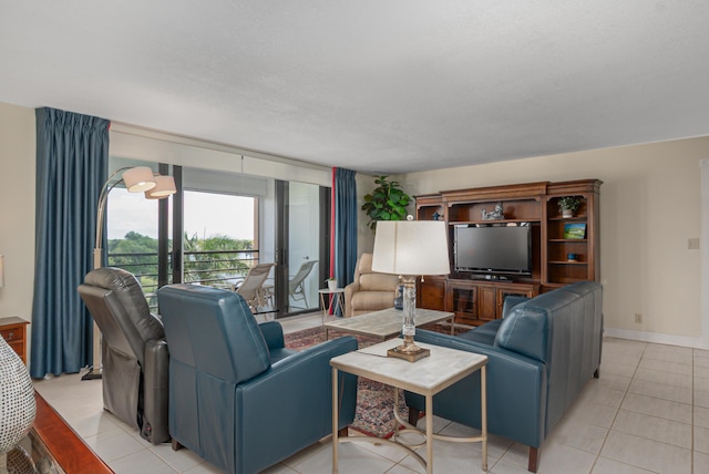 living room with light tile patterned floors and baseboards