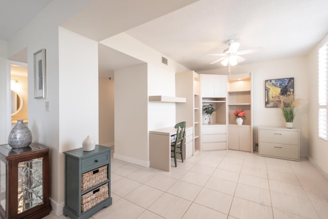 kitchen featuring open shelves, light tile patterned floors, visible vents, ceiling fan, and baseboards