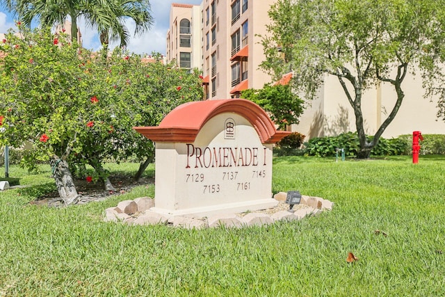 community / neighborhood sign with a lawn