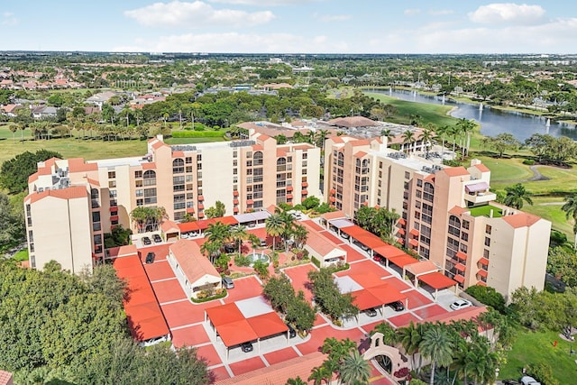 bird's eye view featuring view of golf course and a water view