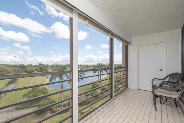 sunroom with a water view