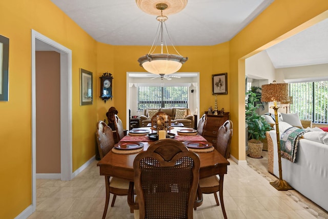 dining area featuring baseboards