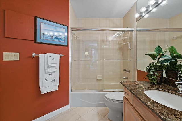 full bath with tile patterned flooring, baseboards, toilet, enclosed tub / shower combo, and vanity