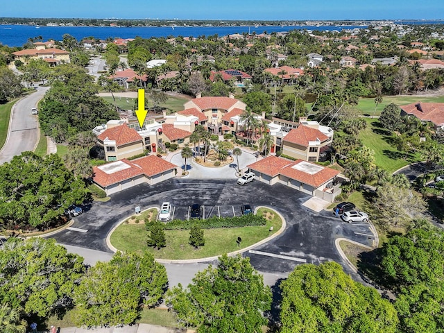 bird's eye view featuring a residential view and a water view