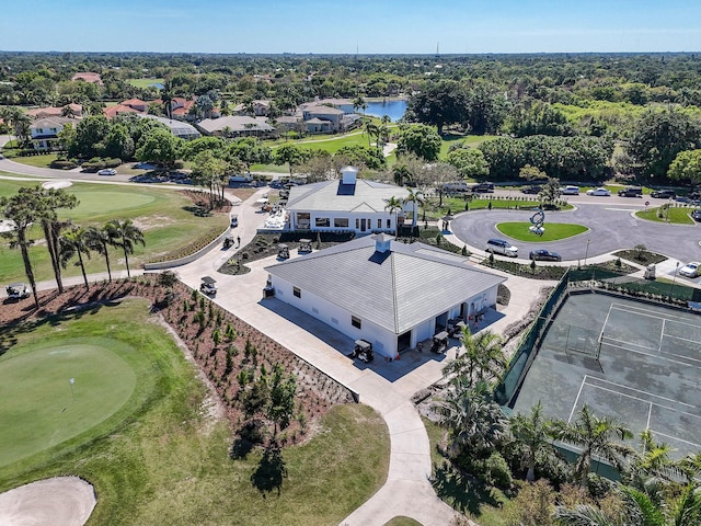 bird's eye view featuring golf course view and a water view