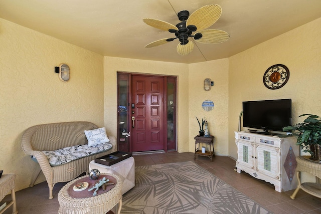 property entrance with a ceiling fan