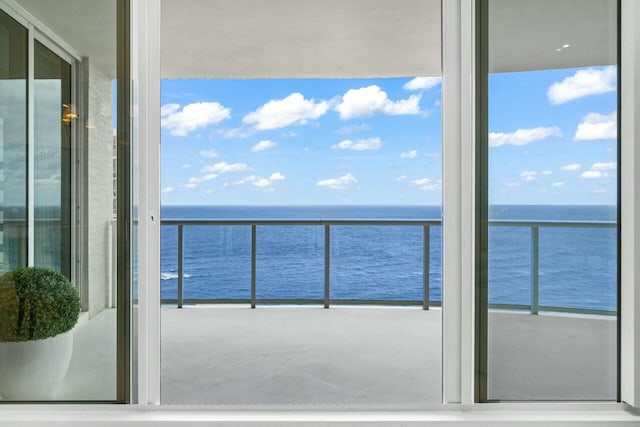 balcony featuring a water view