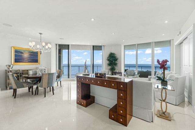 interior space featuring a water view, a healthy amount of sunlight, and floor to ceiling windows