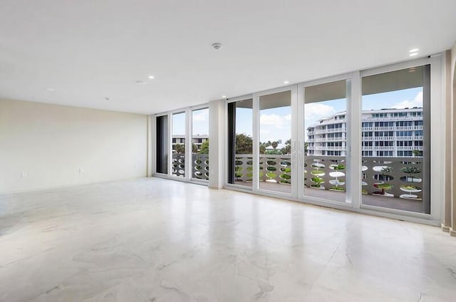 spare room with expansive windows