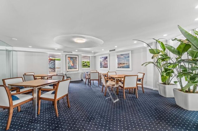 carpeted dining room with visible vents and recessed lighting