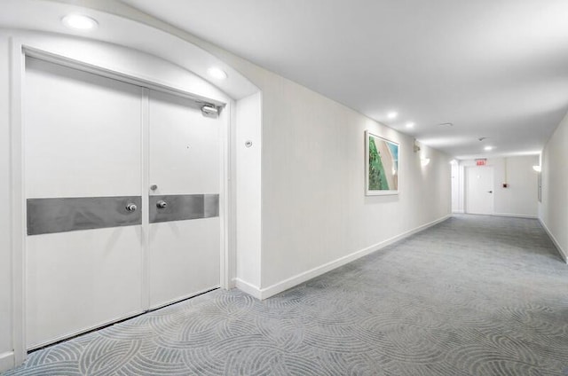 interior space with recessed lighting, carpet flooring, and baseboards