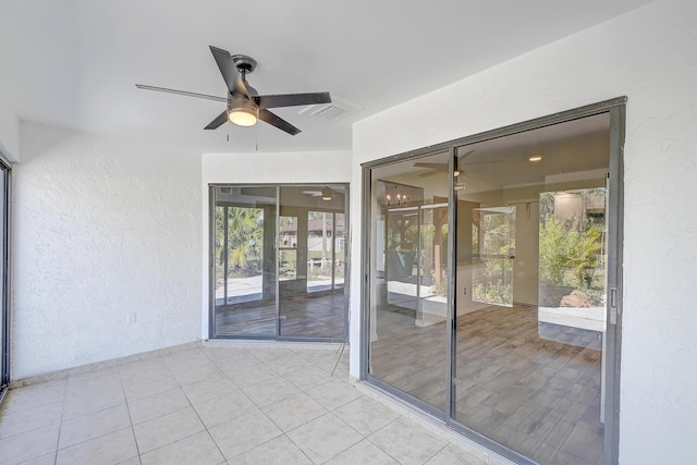 view of patio featuring a ceiling fan