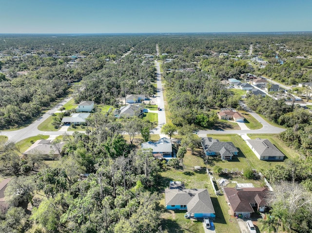 bird's eye view with a forest view and a residential view