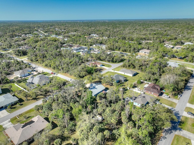 aerial view with a residential view and a wooded view