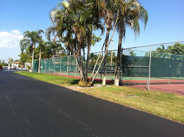 view of tennis court with fence