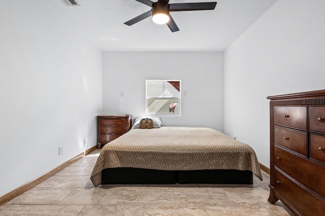 bedroom featuring ceiling fan and baseboards