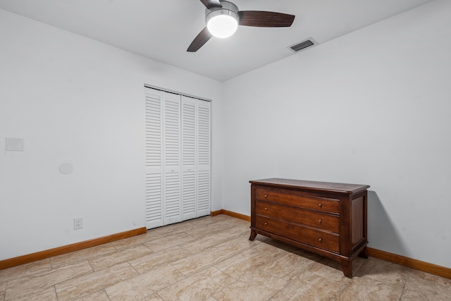 bedroom with a closet, visible vents, ceiling fan, and baseboards