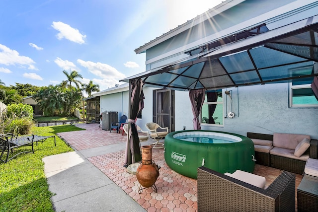 view of patio / terrace featuring a gazebo and central AC unit