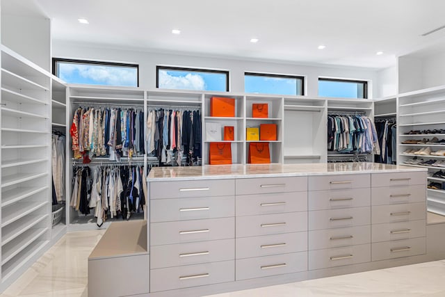 spacious closet featuring marble finish floor and visible vents