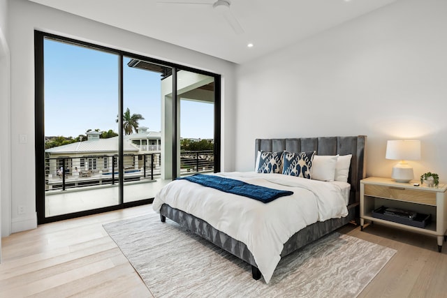 bedroom with access to exterior, ceiling fan, wood finished floors, and recessed lighting