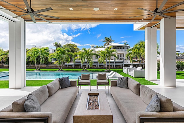 view of patio featuring outdoor lounge area, an outdoor pool, and ceiling fan