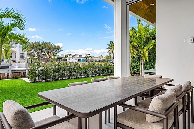 balcony with outdoor dining area