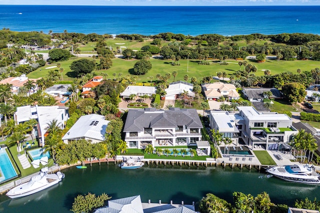 birds eye view of property featuring view of golf course and a water view