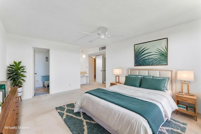 carpeted bedroom featuring visible vents and a ceiling fan