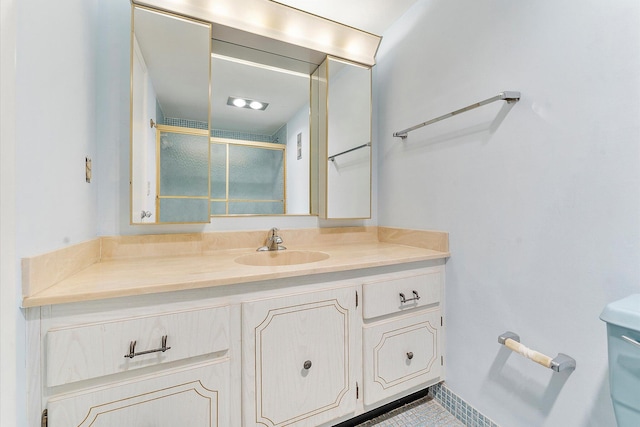 full bathroom with a shower stall and vanity