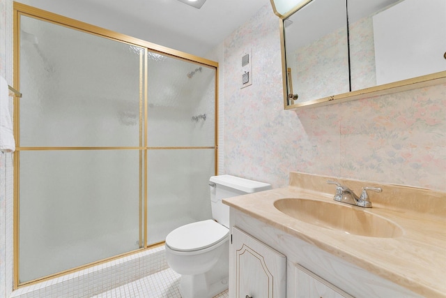 full bath with toilet, vanity, a shower stall, tile patterned flooring, and wallpapered walls