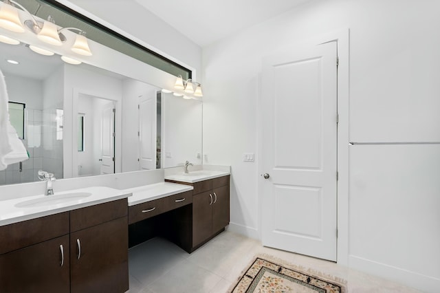 full bath with tile patterned flooring, a shower stall, two vanities, and a sink