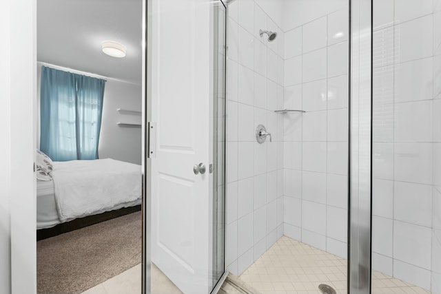 bathroom with connected bathroom and a stall shower