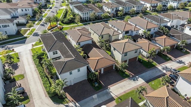 birds eye view of property with a residential view