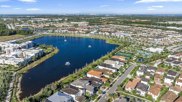 drone / aerial view with a water view and a residential view