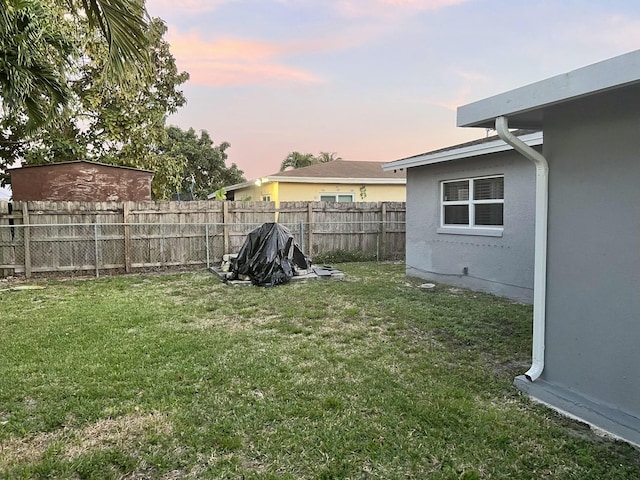 view of yard with a fenced backyard